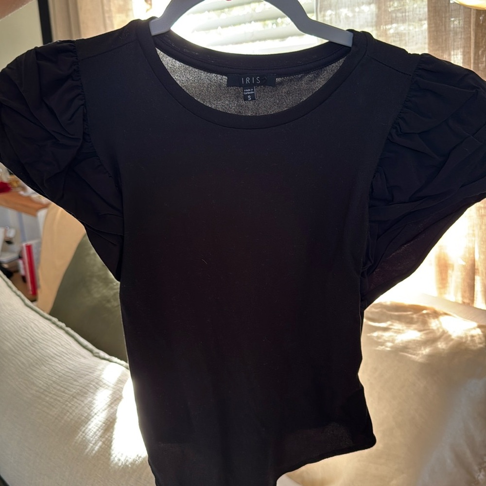 In true Miami fashion, this bodysuit is a Miami staple with the ruffled sleeves.
